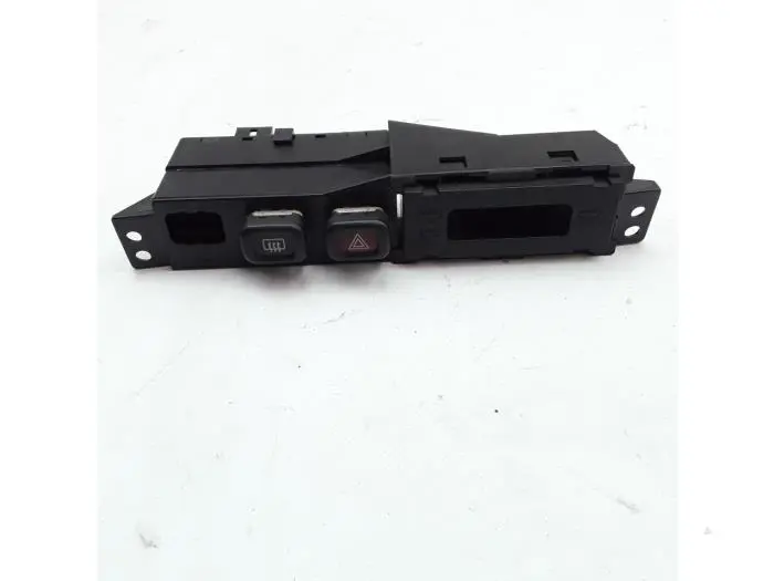 Interruptor de calefactor luneta Mazda 323F